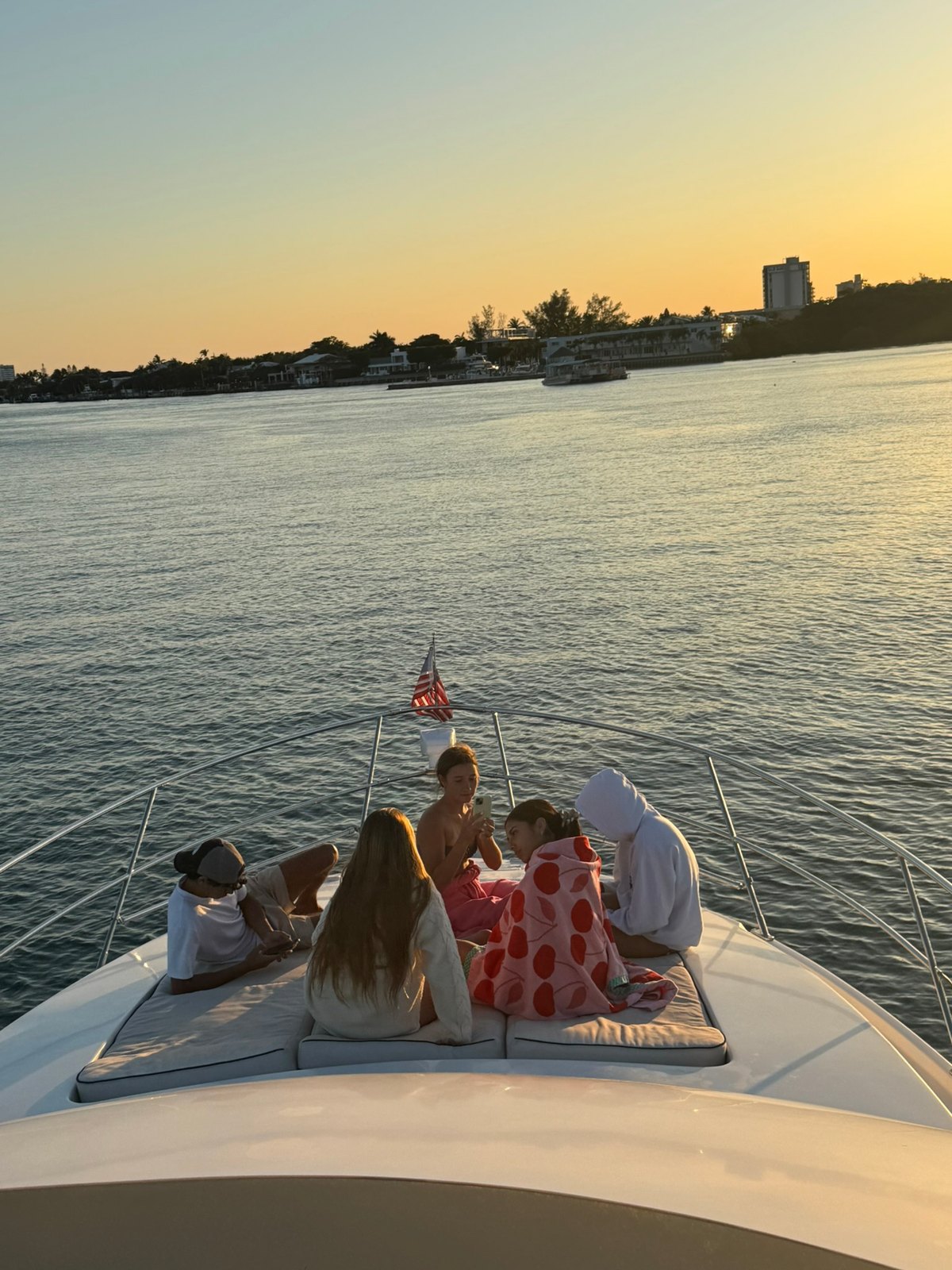Friends on the bow at golden hour