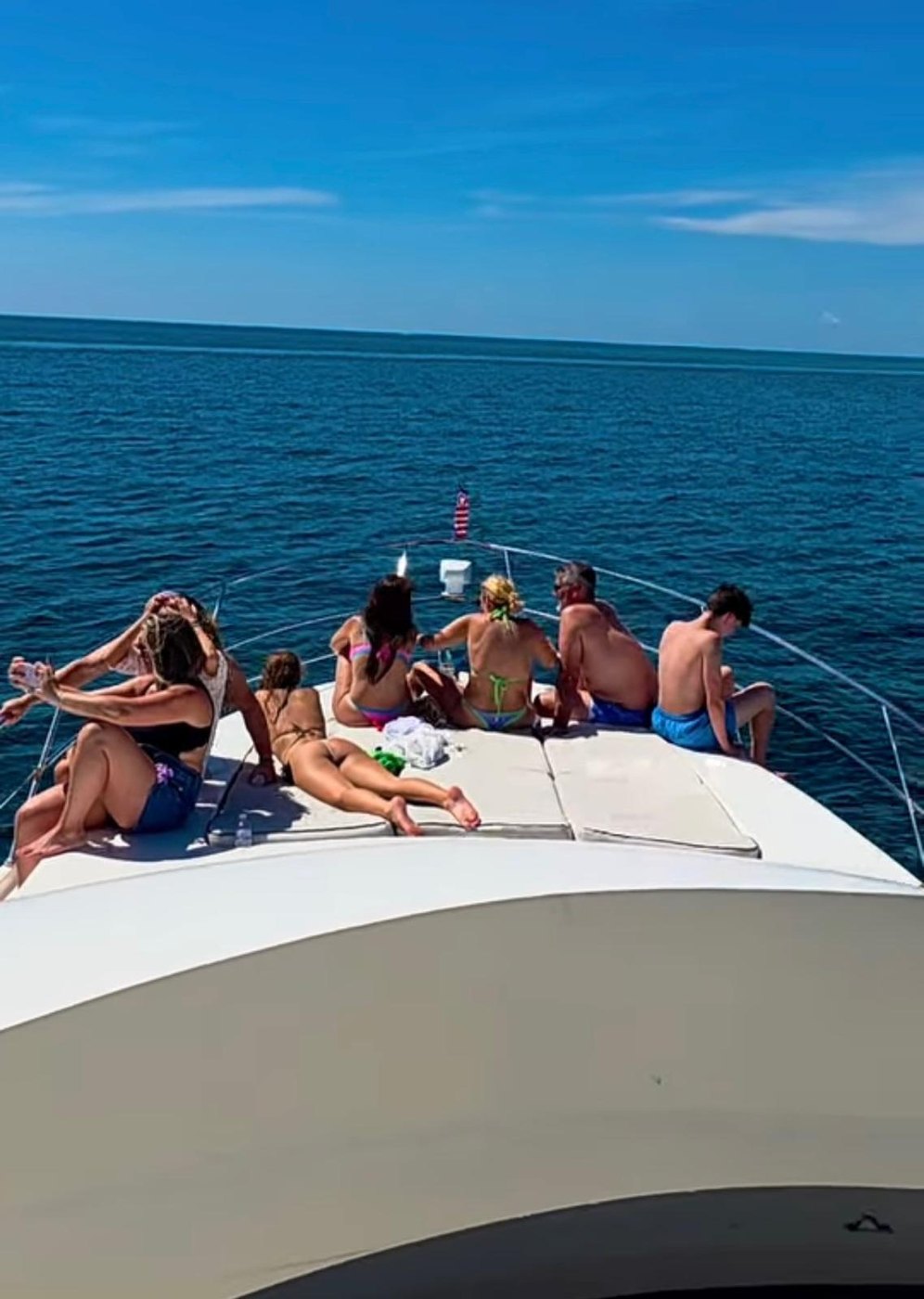 Guests on the bow, open sea