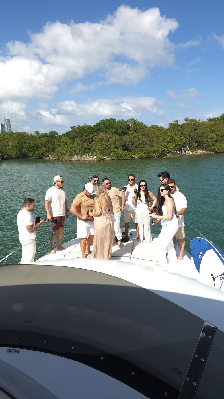 Friends toasting on the bow
