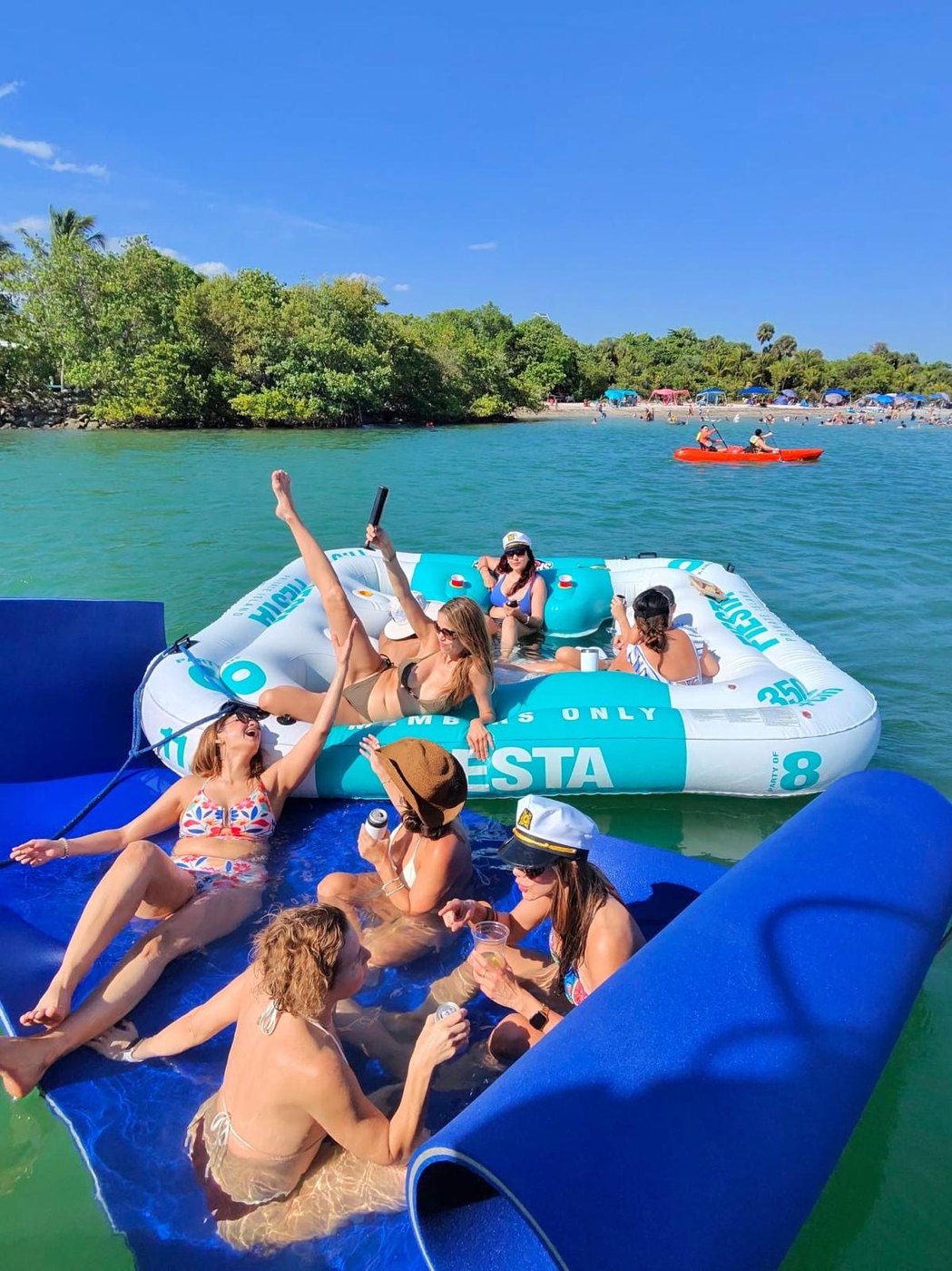 Friends on the float mat and Fiesta float by the beach
