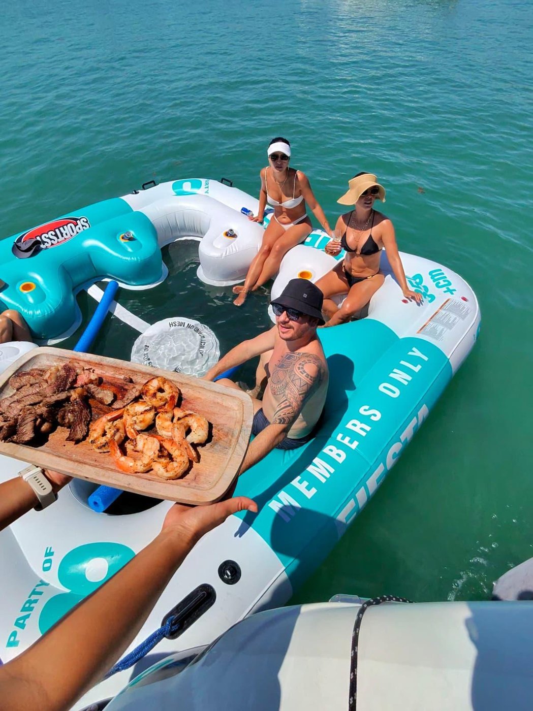 Grilled steak and shrimp served to the float