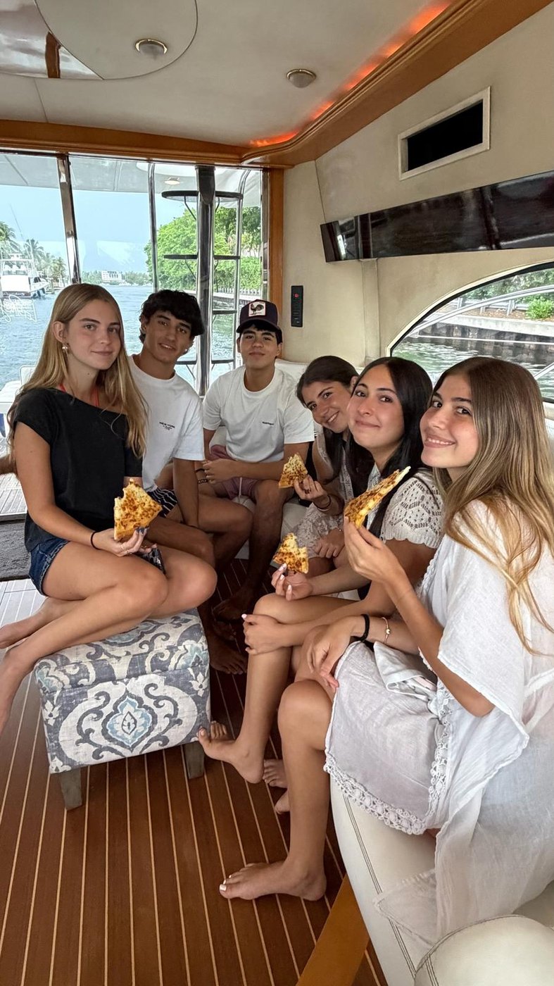 Friends with pizza in the salon